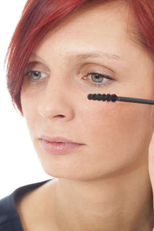 Women applying black mascara on the eyelashesの写真素材