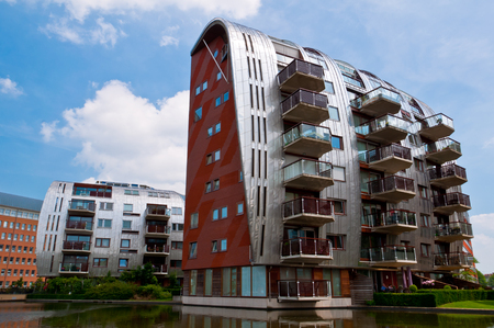 DEN BOSCH, NETHERLANDS - JULY 6, 2013: Modern Apartment Buildings in Den Bosch. Unique architecture residential buildings in a new nice neighborhood near to the central station.のeditorial素材