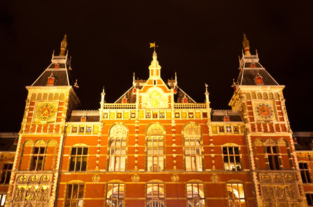 AMSTERDAM - JULY 27: Central Station by night, as seen on July 27, 2013 in Amsterdam, Netherlands. Central Station is the central railway station of Amsterdam and is used by 250,000 passengers a day.のeditorial素材