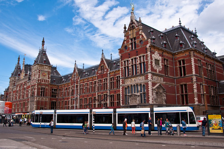 AMSTERDAM - JULY 28: Central Railway Station on July 28, 2013 in Amsterdam. Central Station is the central railway station of Amsterdam and is used by 250,000 passengers a day.のeditorial素材