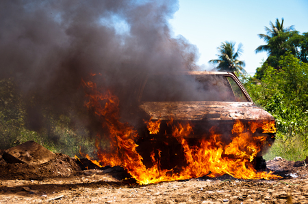 Car on Fire in the FIeldの写真素材