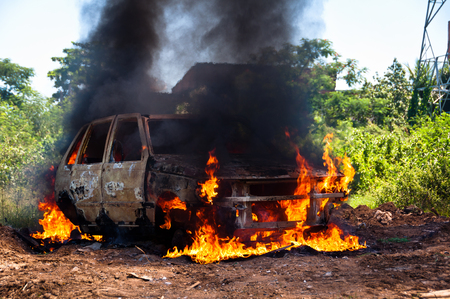 Car on Fire in the FIeldの写真素材
