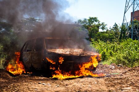 Car on Fire in the FIeldの写真素材