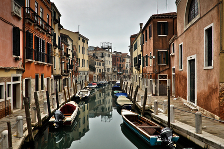 Beautiful View of Canal with Boats in Venice, Italyの写真素材