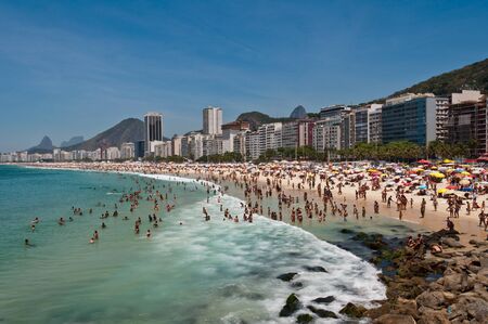 Copacabana Beach Full of People on Hot Summer Day in Rio de Janeiroのeditorial素材