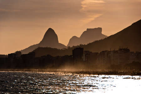 View of Mountains at Copacabana Beach by Sunsetの写真素材