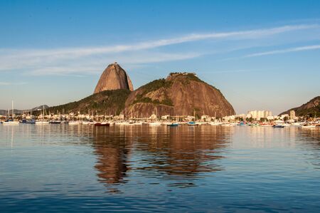 Sugarloaf Mountain with its Reflection in Water Seen from Botafogo Beach, Rio de Janeiro, Brazilの写真素材