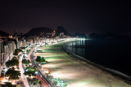 Copacabana Beach at Night with the Sugarloaf Mountain in the Horizon, Rio de Janeiro, Brazilの写真素材