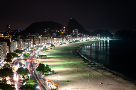 Copacabana Beach at Night with the Sugarloaf Mountain in the Horizon, Rio de Janeiro, Brazilの写真素材
