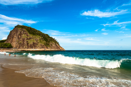 Waves Crashing at Leme Beach in Rio de Janeiro, With the Mountain in the Horizonの写真素材