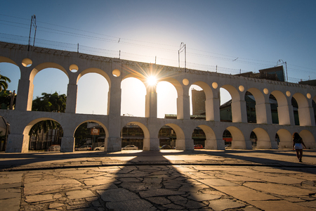 Beautiful View of Sun Shining Through Landmark Lapa Arch in Rio de Janeiro City Downtownの写真素材