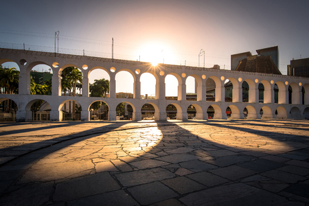 Beautiful View of Sun Shining Through Landmark Lapa Arch in Rio de Janeiro City Downtownの写真素材