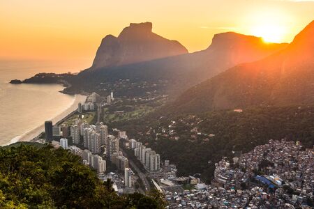 View of Sao Conrado During Beautiful Colorful Sunset Behind Mountains of Rio de Janeiro, Brazilの写真素材