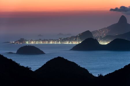 View of Copacabana Beach Lights at Night and Mountains of Rio de Janeiroの写真素材