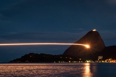 Light Trail From a Landing Aircraft with the Sugarloaf Mountain in Rio de Janeiroの写真素材