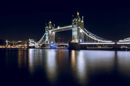 Tower Bridge Illuminated at Night in London, UKの写真素材