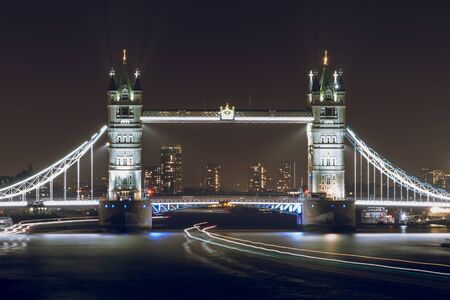 Tower Bridge Illuminated at Night in London, UKの写真素材