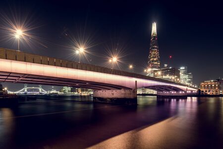 View of Illuminated London Bridge and the Shard at Nightの写真素材