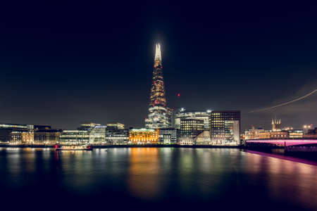 View of Illuminated Buildings at Night With the Shard in the Middle, in the City of London, UKのeditorial素材