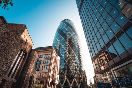 Modern architecture 30 St Mary Axe building, also known as the Gherkin, and is an Iconic building in the City of London business districtの写真素材