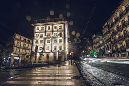 Porto, Portugal - November 19, 2019: Historical building in the city center decorated with Christmas lights.のeditorial素材
