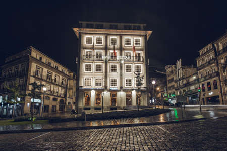 Porto, Portugal - November 19, 2019: Historical building in the city center decorated with Christmas lights.のeditorial素材