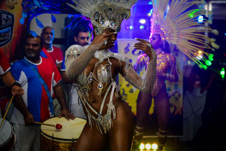 Rio de Janeiro, Brazil - June 5, 2019: Pretty samba dancer performing in a carnival block party at night.のeditorial素材