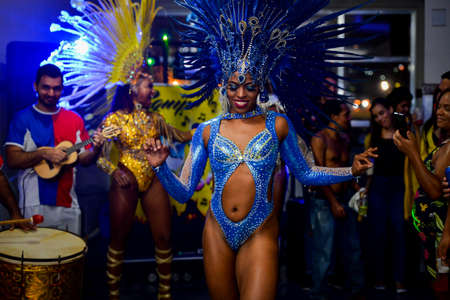 Rio de Janeiro, Brazil - June 5, 2019: Pretty samba dancer performing in a carnival block party at night.のeditorial素材