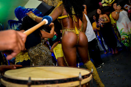 Rio de Janeiro, Brazil - June 5, 2019: Pretty samba dancer performing in a carnival block party at night.のeditorial素材