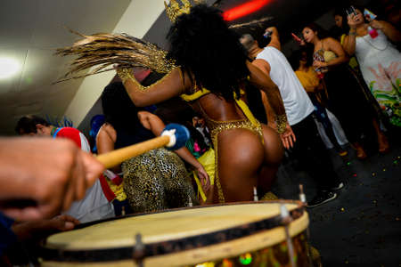 Rio de Janeiro, Brazil - June 5, 2019: Pretty samba dancer performing in a carnival block party at night.のeditorial素材