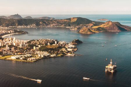 Aerial View of Guanabara Bay, Niteroi City, Oil Platform, Ships and the Ocean in the Horizon, Rio de Janeiro, Brazilの写真素材