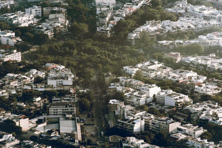 Aerial View of Houses With Streets With Trees Between Themの写真素材