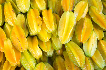Pile of Fresh Star Apple or Carambola Fruits at the Marketの写真素材
