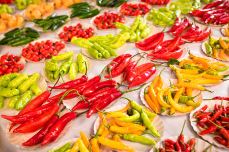 Various Kinds of Pepper in Small Paper Plates at Brazilian Marketの写真素材
