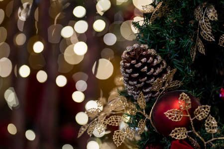 Beautiful Decorative Pine Cone With Christmas Lights Backgroundの写真素材