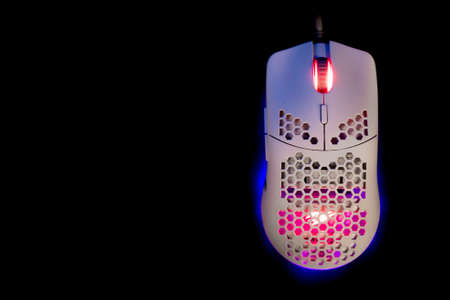 White Gaming Mouse With Led Lights on Black Backgroundの写真素材