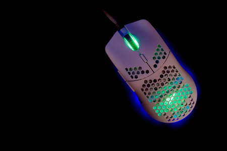 White Gaming Mouse With Led Lights on Black Backgroundの写真素材