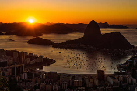 Golden Sunrise over Guanabara Bay in Rio de Janeiro with Sugarloaf Mountain in the Horizon