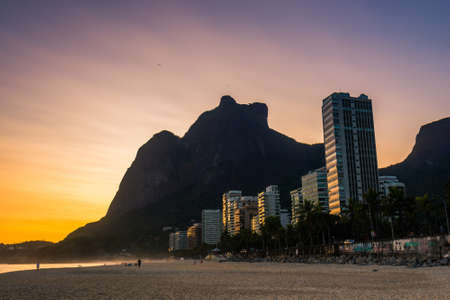 Warm Sunset at Empty Sao Conrado Beach in Rio de Janeiro With Luxury Apartment Buildings and Pedra da Gavea Viewの写真素材