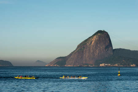 Two Rowing Boats in Guanabara Bay in Rio de Janeiro With the Sugarloaf Mountain in the Horizonの写真素材