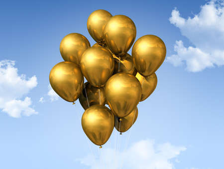 gold air balloons floating on a blue skyの写真素材