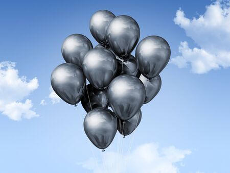 silver air balloons floating on a blue skyの写真素材