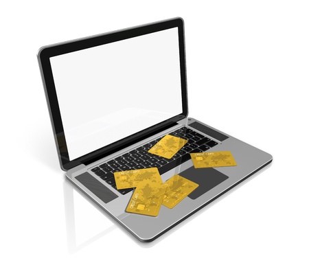 3D render of many gold credit cards on a laptop - isolated on white with clipping pathの写真素材