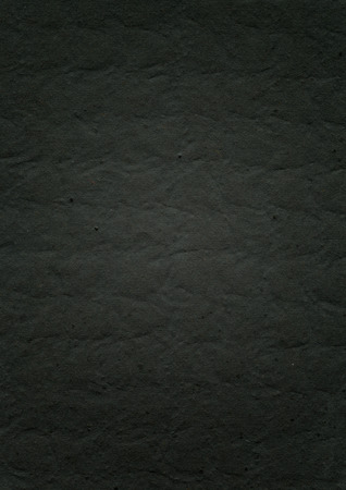 embossed black paper texture background wallpaperの写真素材