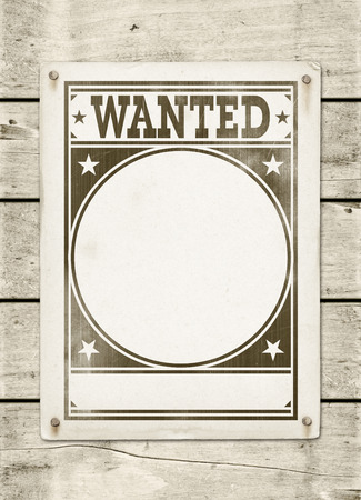 Wanted poster on a white wood board panelの写真素材