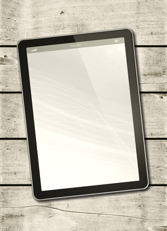 Digital tablet PC on a white wood table - vertical office mockupの写真素材