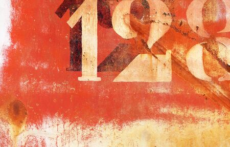 old rusty painted metal wall with numbers, wallpaper backgroundの写真素材