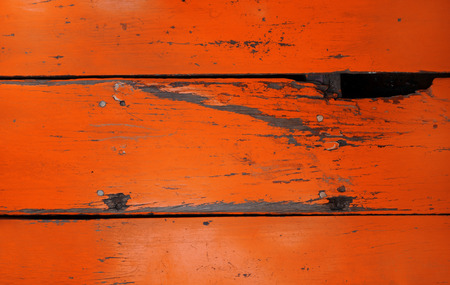 Old wood board painted red, background textureの写真素材