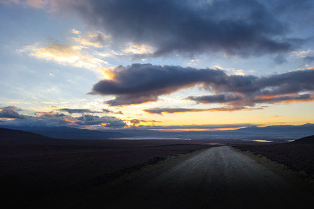 sunset on altiplano mountains road in sud Lipez reserva Eduardo Avaroa, Boliviaの写真素材