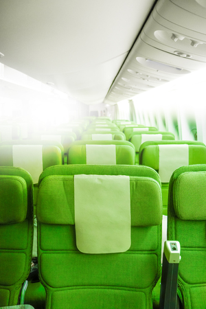 Green Airplane seats in cabin. Interior viewの写真素材